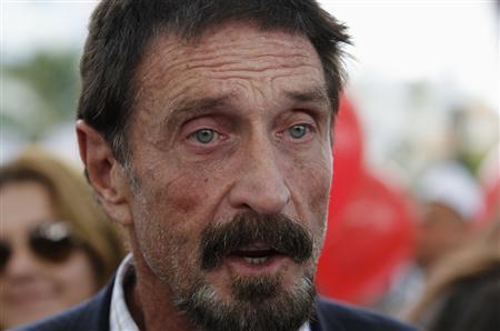 McAfee says will not return to Belize, willing to talk to police